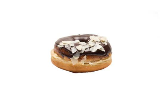 Chocolate glazed doghnut with almond flakes on white background. High resolution image for food industry.