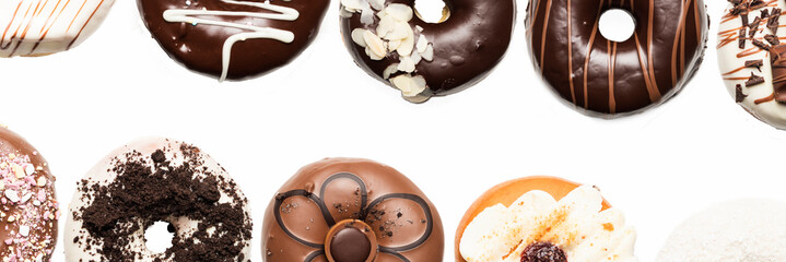 Multiple doughnuts on white background. High resolution image for food industry.