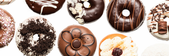 Multiple doughnuts on white background. High resolution image for food industry.