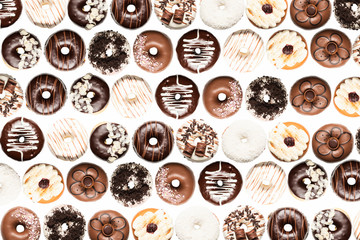 Multiple doughnuts on white background. High resolution image for food industry.