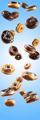 Multiple doughnuts on blue background. High resolution image for food industry.