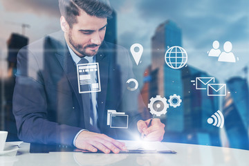 Businessman writing in city, internet interface