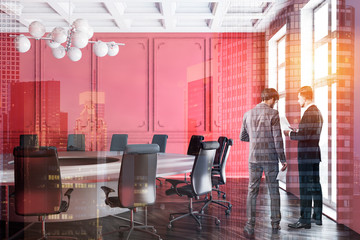 Red meeting room interior, people