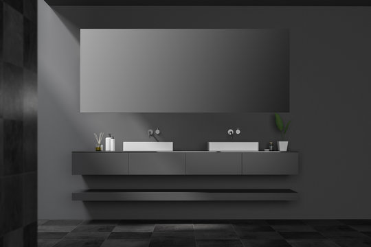 Tiled black double bathroom sink with mirror