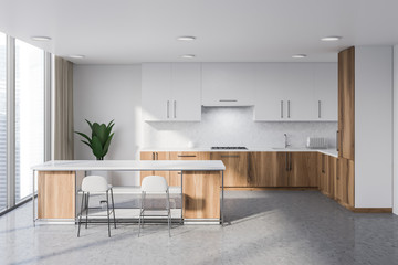White and wooden kitchen with bar