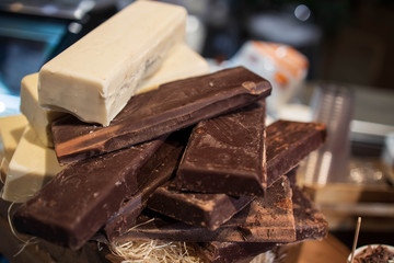 Stacked bars of chocolate ready to be used in dessert dishes