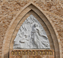 Sculpture on the facade of the front of the Ave Maria Catholic Church in Ave Maria, Florida