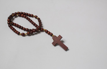 Fototapeta na wymiar Catholic wooden rosary on white background