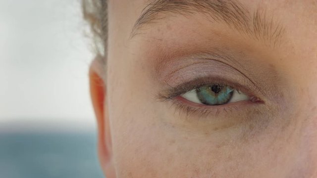 close up beautiful eye opening in beach background healthy vision concept