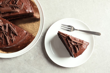 Flat lay composition with tasty chocolate cake on table