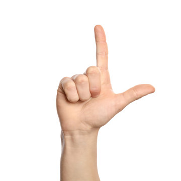 Man showing L letter on white background, closeup. Sign language