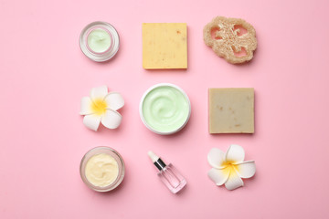 Flat lay composition with body care products on color background