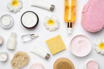 Flat lay composition with body care products on white background