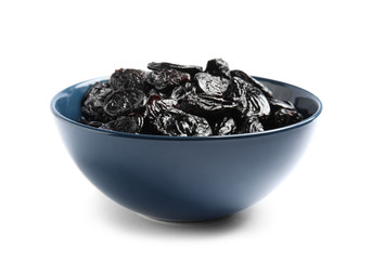 Bowl of tasty prunes on white background. Dried fruit as healthy snack