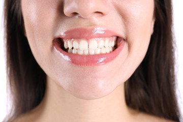 Young smiling woman with healthy teeth, closeup