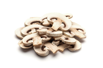 Slices of fresh champignon mushrooms on white background