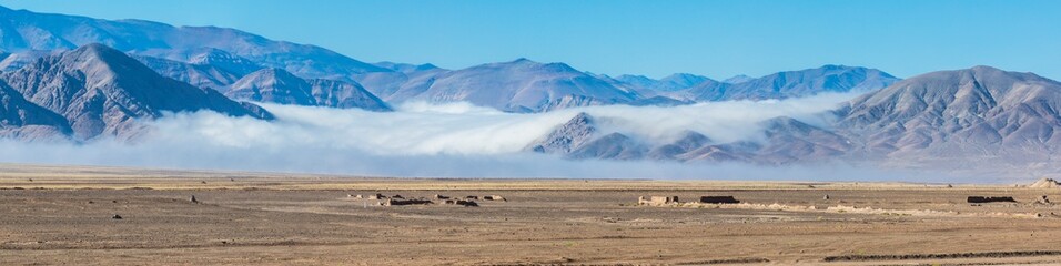 The Camanchaca (Humidity from the sea) creates morning clouds at Atacama Desert altiplano, amazing arid and dry landscape with life because of humidity coming from the sea. Life in extreme conditions
