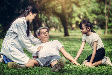 Senior man having chest pain or heart attack in the park. Old people elderly healthcare concept.