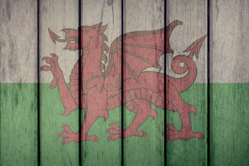 Wales Politics News Concept: Welsh Flag Wooden Fence