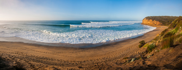 Panorama of perfect surf rolling into Bells Beach, Great Ocean Road, Victoria, Australia