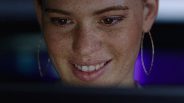 close up portrait beautiful woman using tablet computer smiling enjoying browsing internet looking at screen working late