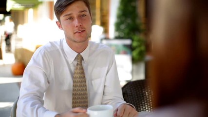 American business friends sitting enjoying coffee