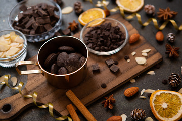 chocolates, ingredients on black table  
