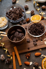 chocolates, ingredients on black table  