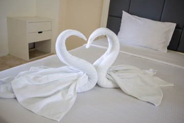 white two towel swans