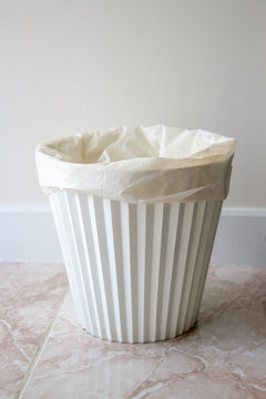 white plastic rubbish bin