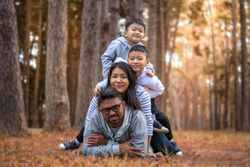 Young family with children having fun in nature