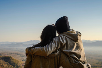 silhouette of a couple on sunrise background in the morning. copy space for text. happiness concept. as valentine's day concept