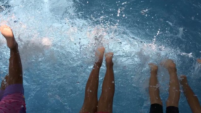 children learning swimming class in swimming pool
