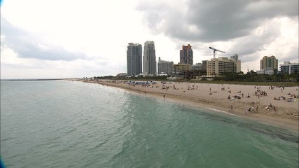 Aerial view people relaxing on South Beach Miami 