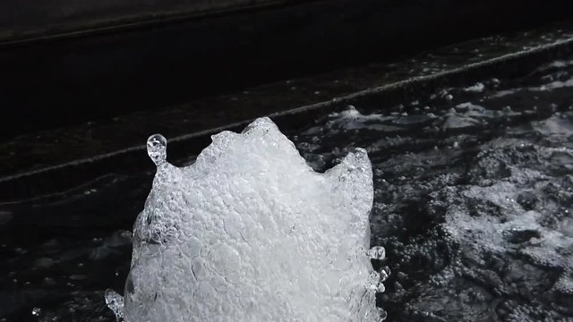 Macro shot of water fountain shoot up and drop splashing in slow motion full HD, 1080p