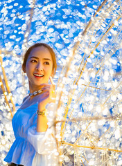 portrait asian beautiful women of smiling with blur bokeh light background and fashion shirt white or jeans