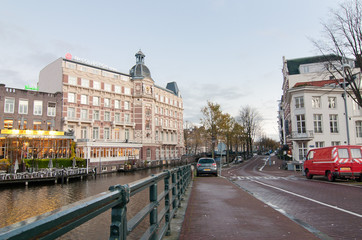 Fototapeta premium View of Halvemaansbrug bridge along canal in Amsterdam. the Netherlands.