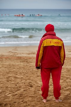 An Australian Life Guard Watches Over The Beach