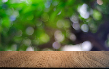 Empty dark wooden table in front of abstract blurred bokeh background of restaurant . can be used for display or montage your products.Mock up for space.