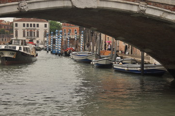 Narrow canals and alleyways in Venice. City of monuments in gondola.