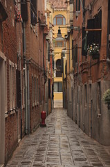 Fototapeta premium Narrow canals and alleyways in Venice. City of monuments in gondola.