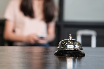 Hotel reception counter desk with service bell.