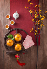 Conceptual flat lay Chinese New Year food and drink still life. Text appear in image: Prosperity.