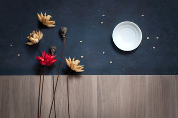 Conceptual water lily flowers on night sky background still life.