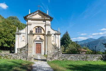 Naklejka premium Lake Maggiore, Italy. Art, history and nature around the lake. Church of San Martino Vescovo (12th century) in Campagnano village above Maccagno town in Veddasca valley