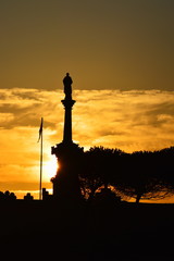 The sun rising over Comillas in a summer morning, Cantabria, Spain	