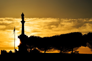 The sun rising over Comillas in a summer morning, Cantabria, Spain	
