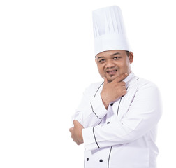 portrait of young male chef standing confident crossed hands pose look at a front of the camera