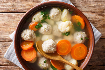 Danish soup with double dumplings and vegetables close-up in a bowl. horizontal top view