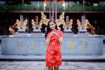 Portrait of Asian Chinese and Thai girl with Happy Chinese New Year concept.
